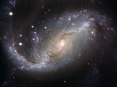 Image montrant la galaxie NGC 1672 et les étoiles de l'univers. (Source de l'image : WikiImages - Pixabay)