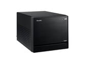 L'image montre une vue de face du Shuttle XPC Mini PC, qui ressemble à un cube noir au design minimal.