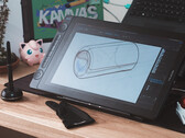 Huion Kamvas 16 Gen 3 sur le bureau avec gant de dessin à stylet et clavier